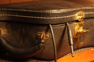 Opening guitar case when transporting in cold