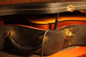 Opening guitar case when transporting in cold